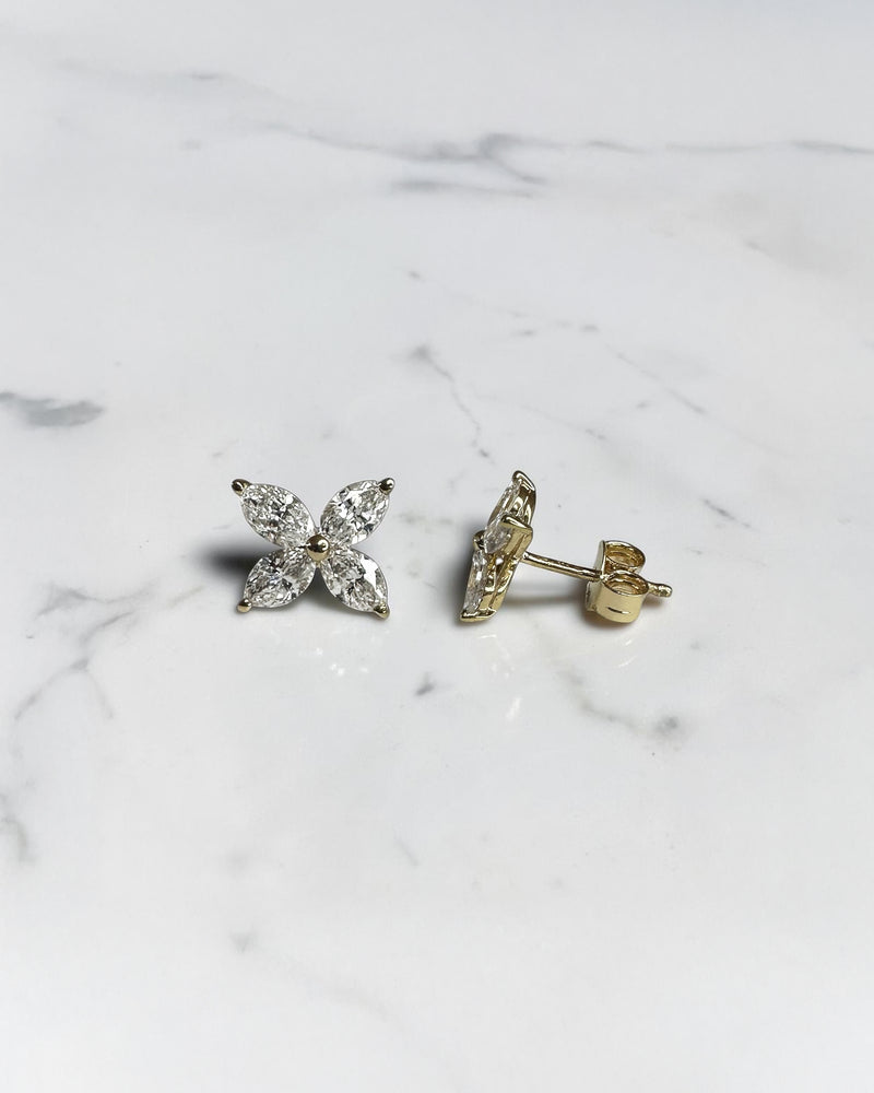 1.40ct marquise diamond flower stud earrings in yellow gold featuring four marquise cut diamonds per earring, available in lab grown or natural diamonds.
