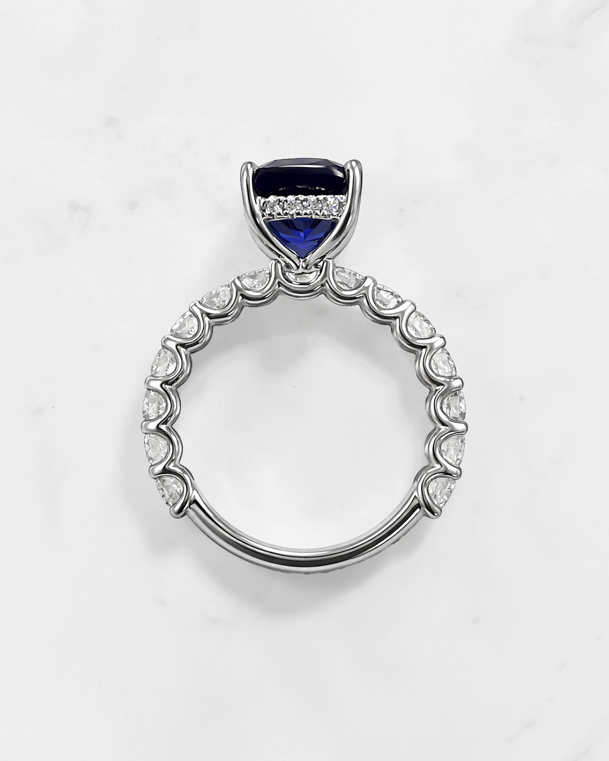 5.50ct cushion cut lab grown blue sapphire engagement ring with diamond hidden halo and 1.60ct lab grown diamond band in platinum.