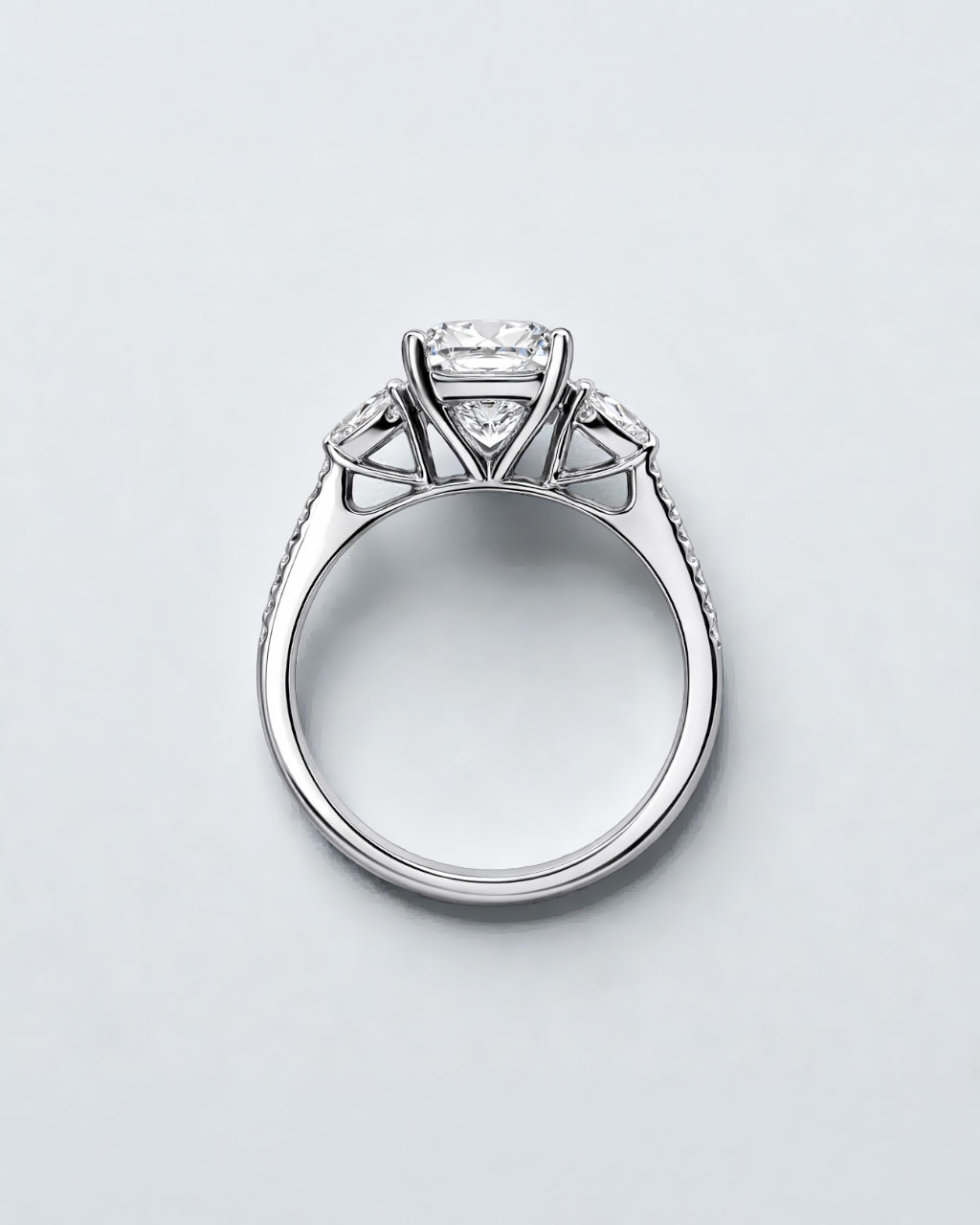 5ct radiant cut lab grown diamond engagement ring with heart side stones and diamond shoulders in polished platinum