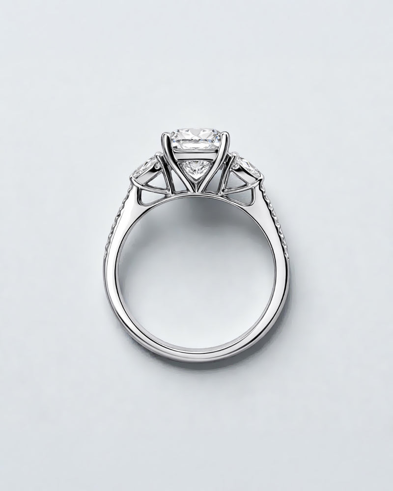 5ct radiant cut lab grown diamond engagement ring with heart side stones and diamond shoulders in polished platinum