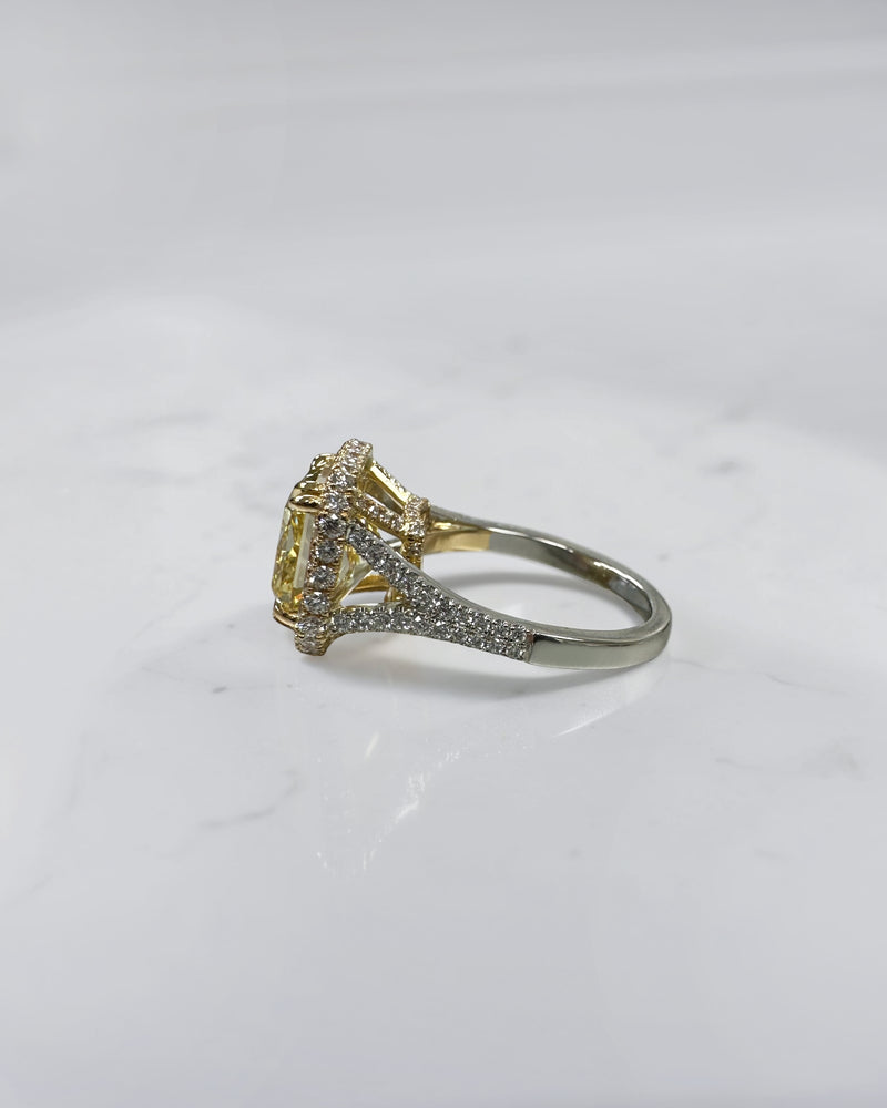 5ct square lab grown cushion cut yellow diamond engagement ring with 3D diamond halo and split shoulder band in 18kt yellow and white gold.
