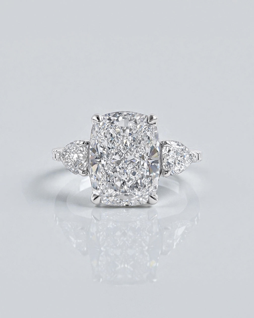 5ct radiant cut lab grown diamond engagement ring with heart side stones and diamond shoulders in polished platinum