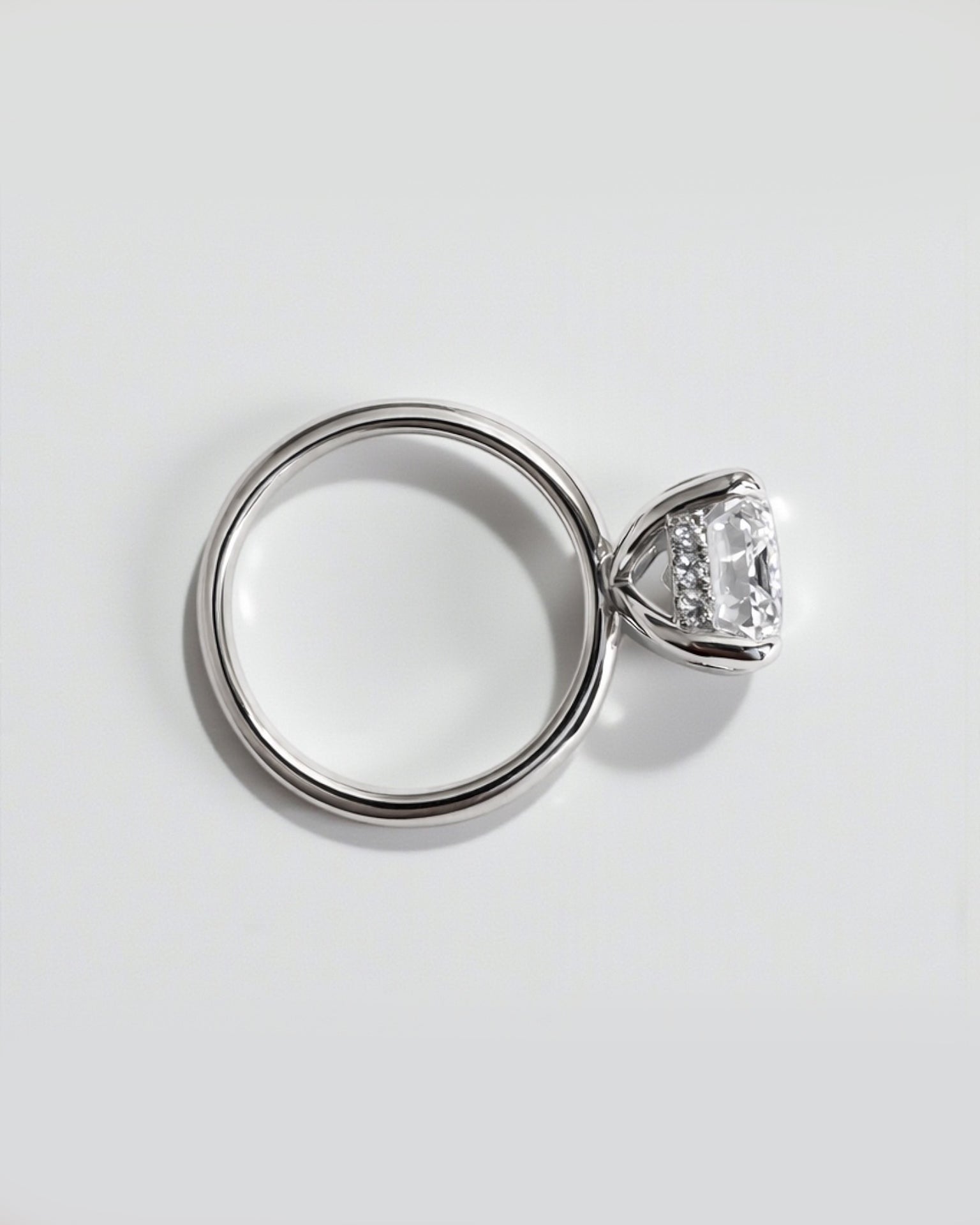 Emerald cut lab grown diamond solitaire engagement ring with hidden halo, 5ct centre stone. 9kt white gold, 18kt white gold, platinum