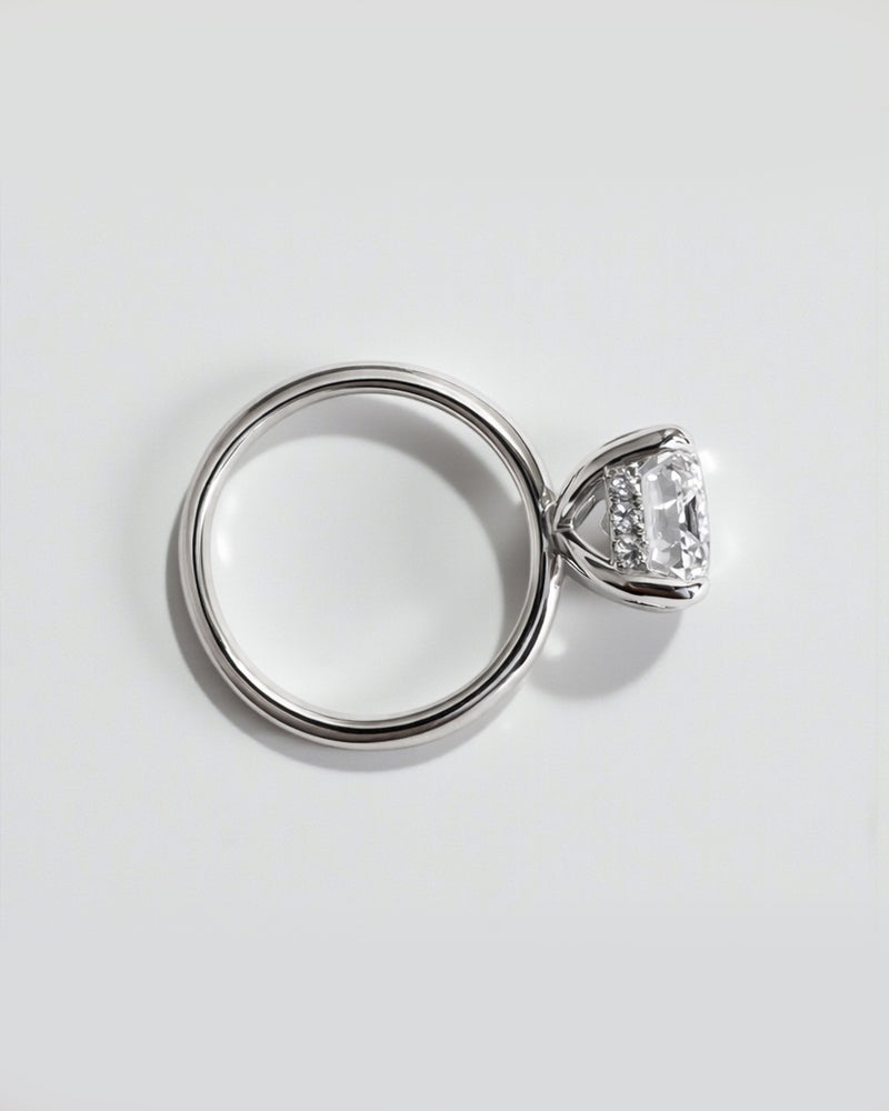 Emerald cut lab grown diamond solitaire engagement ring with hidden halo, 5ct centre stone. 9kt white gold, 18kt white gold, platinum