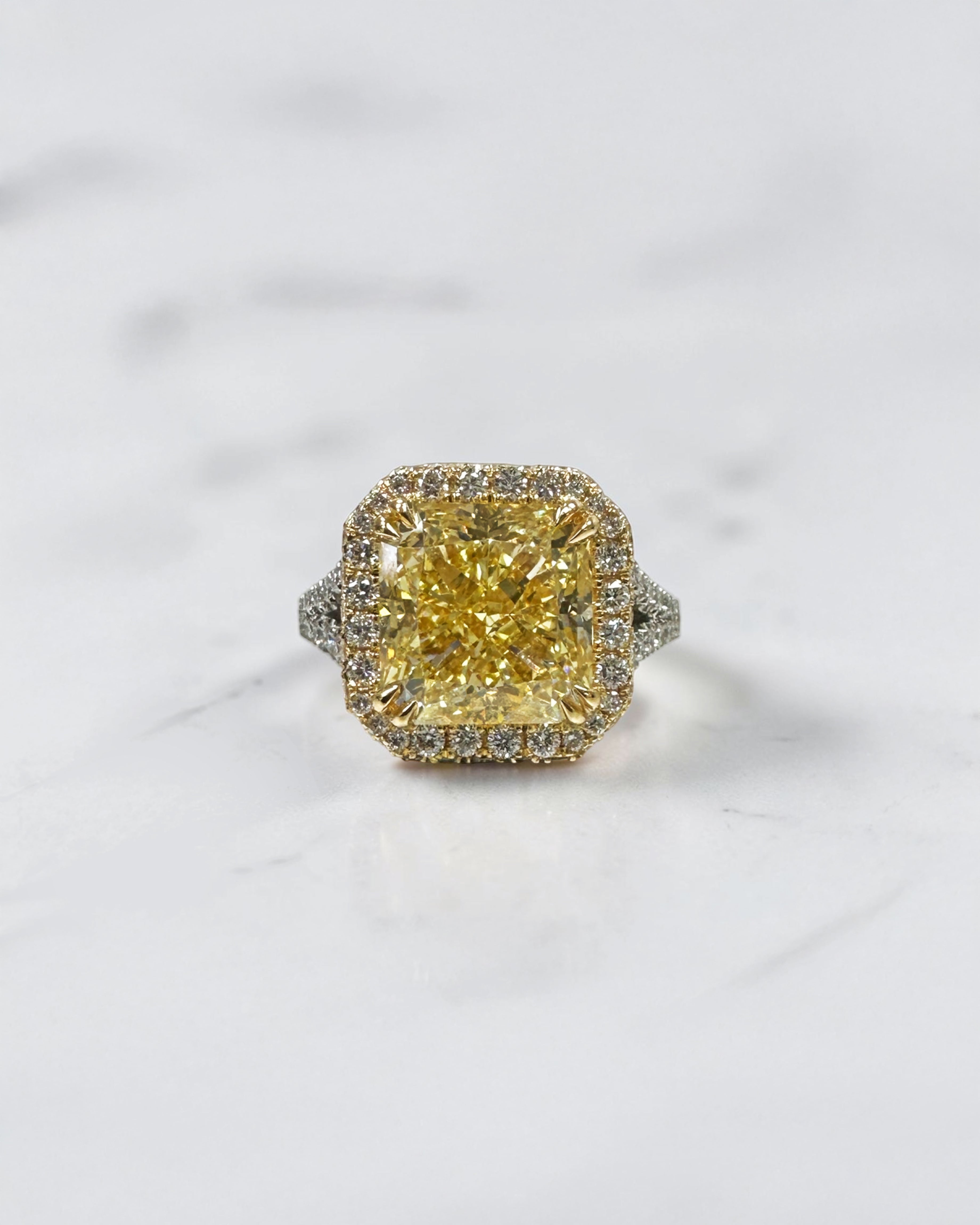 5ct square lab grown cushion cut yellow diamond engagement ring with 3D diamond halo and split shoulder band in 18kt yellow and white gold.