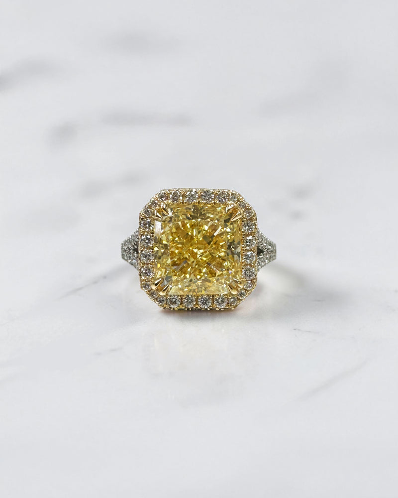5ct square lab grown cushion cut yellow diamond engagement ring with 3D diamond halo and split shoulder band in 18kt yellow and white gold.
