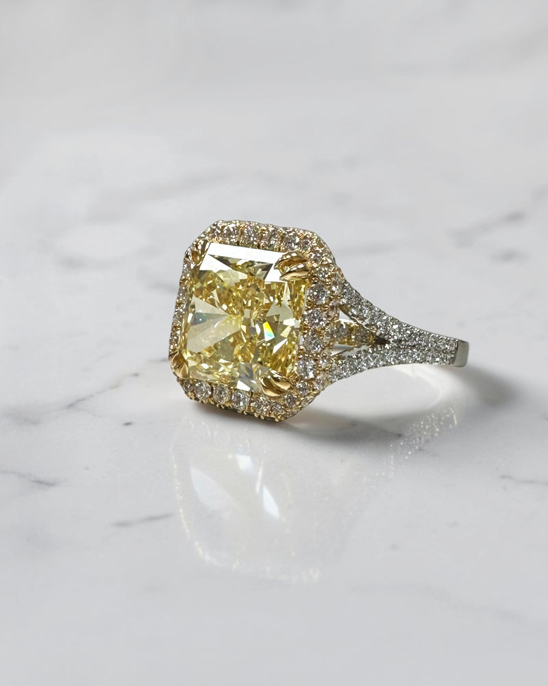 5ct square lab grown cushion cut yellow diamond engagement ring with 3D diamond halo and split shoulder band in 18kt yellow and white gold.