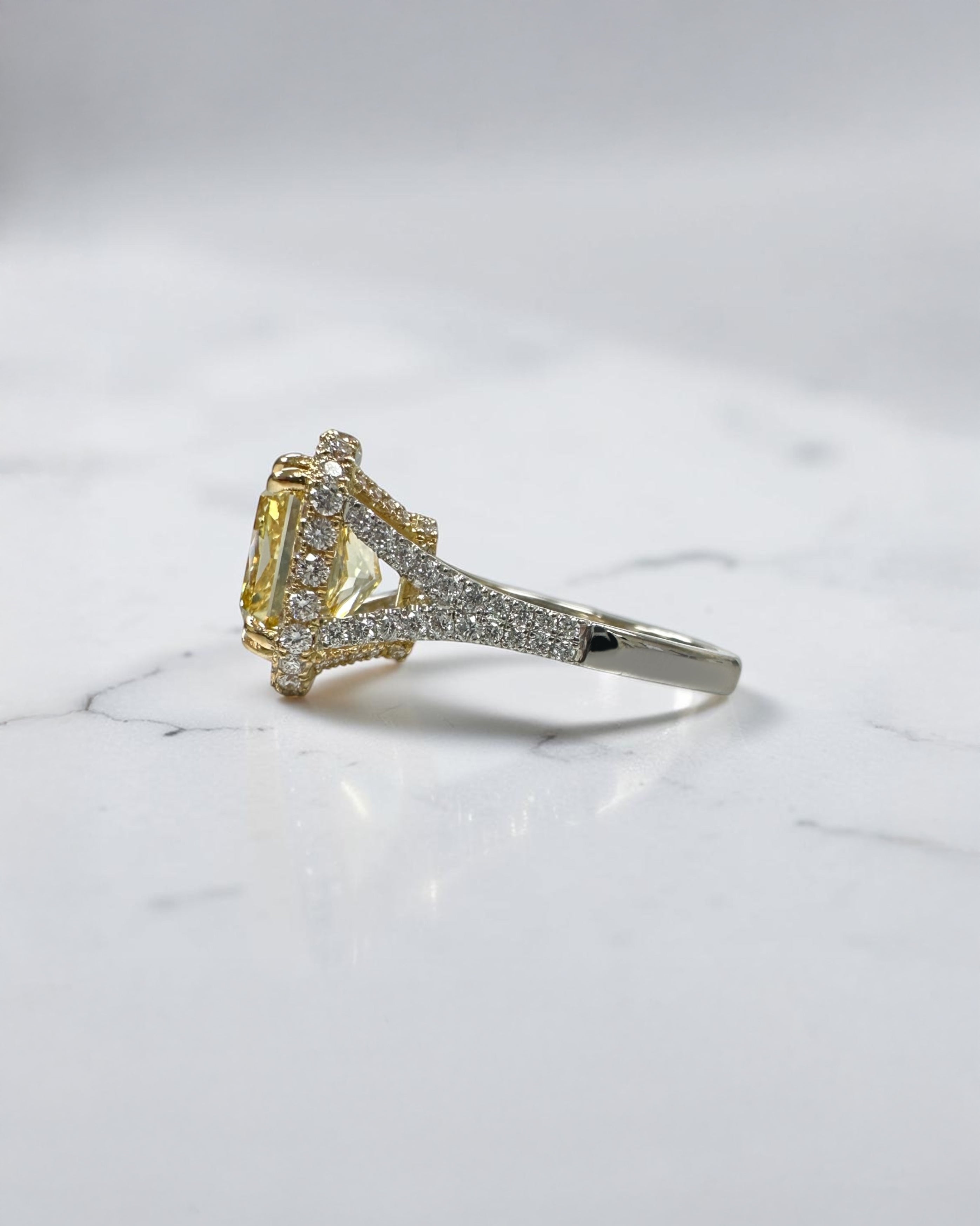 5ct square lab grown cushion cut yellow diamond engagement ring with 3D diamond halo and split shoulder band in 18kt yellow and white gold.