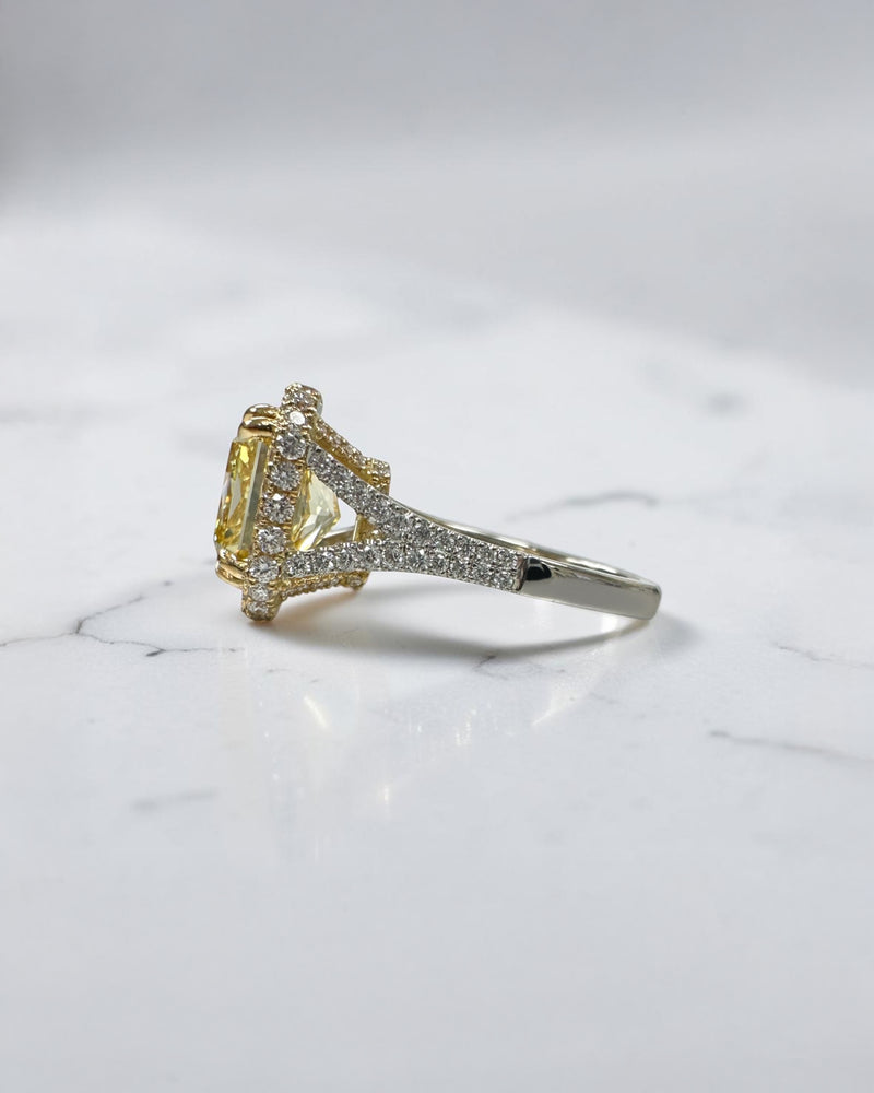 5ct square lab grown cushion cut yellow diamond engagement ring with 3D diamond halo and split shoulder band in 18kt yellow and white gold.