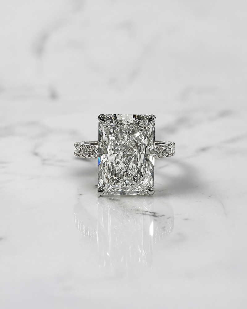 7ct radiant cut lab grown diamond engagement ring with diamond shoulder band, floating setting and wrap around hidden halo, handmade in London.