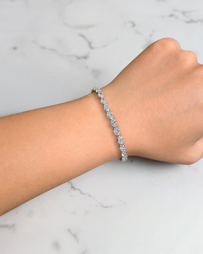10ct oval cut diamond tennis bracelet in white gold featuring approximately 10 carats of oval diamonds with a 4.80mm width, available in lab grown or natural diamonds.