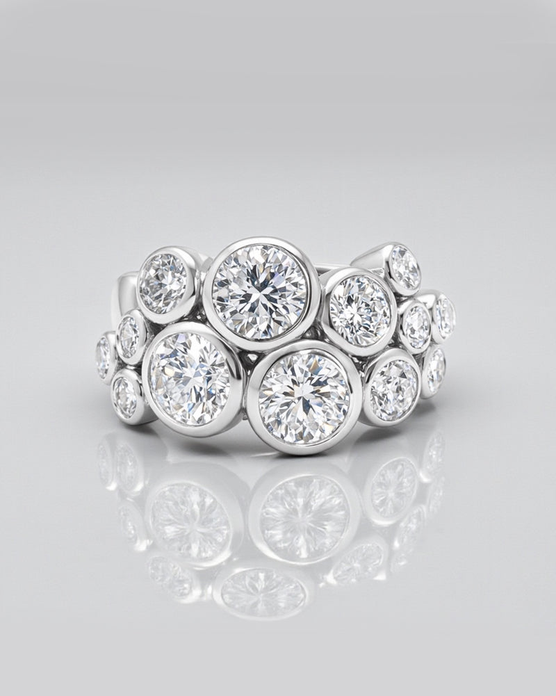 Bubble diamond ring with bezel set round diamonds, front view showing clustered bubble design. 9kt or 18kt yellow or white gold