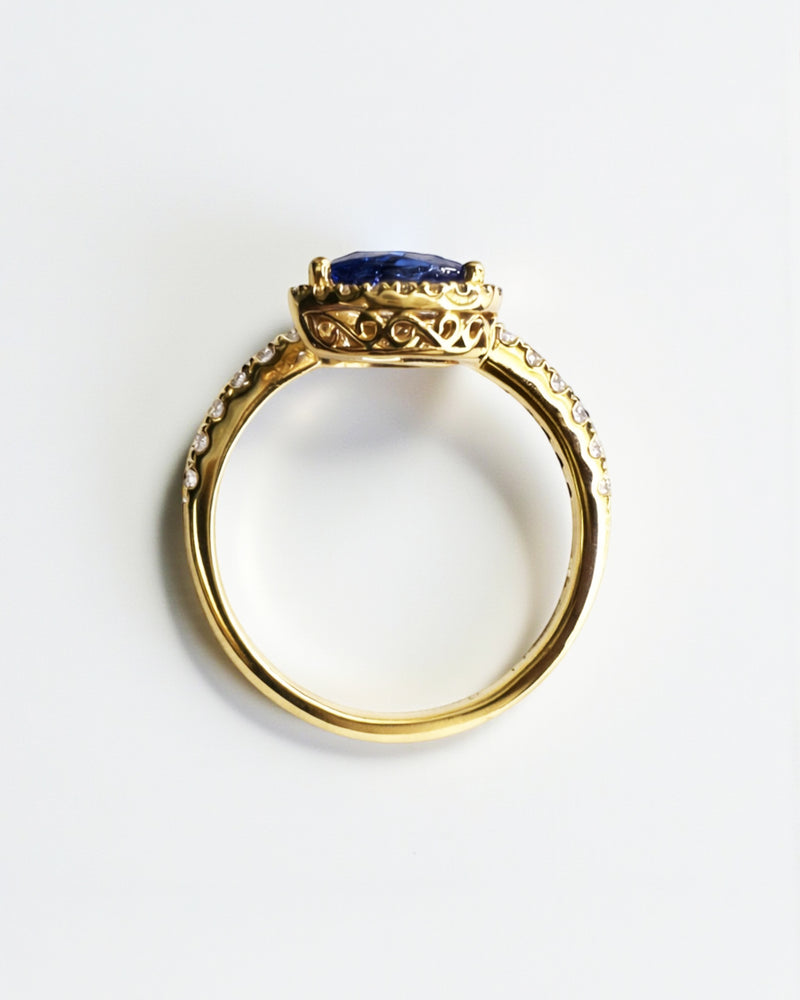 Two stone pear cut blue sapphire and diamond halo ring in 18kt yellow gold
