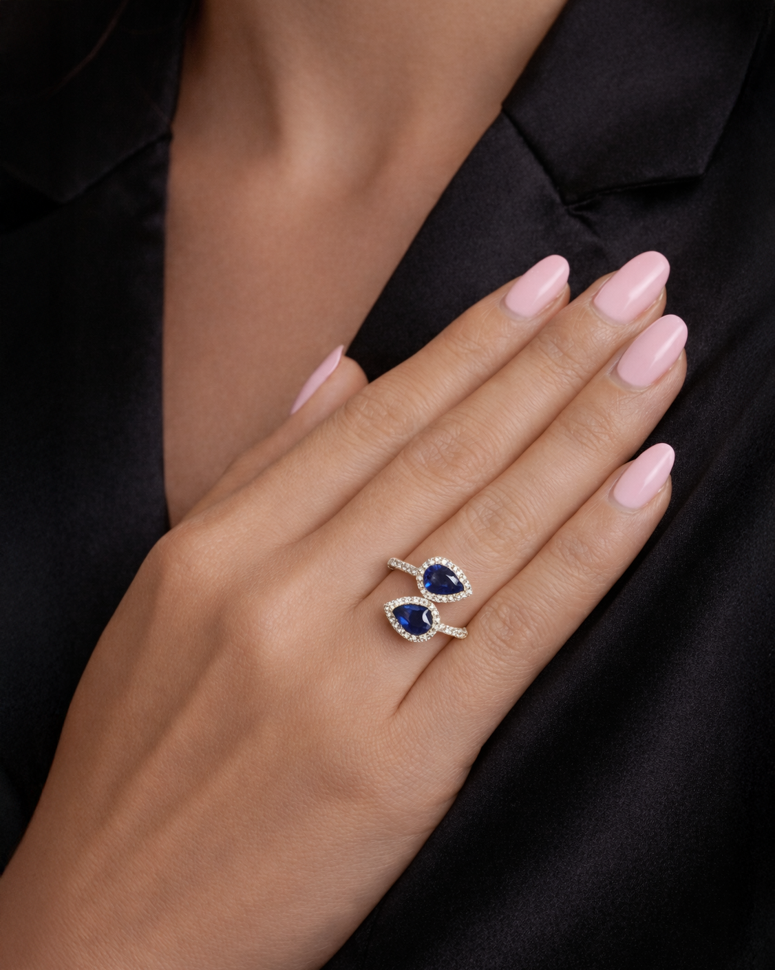 Two stone pear cut blue sapphire and diamond halo ring in 18kt yellow gold