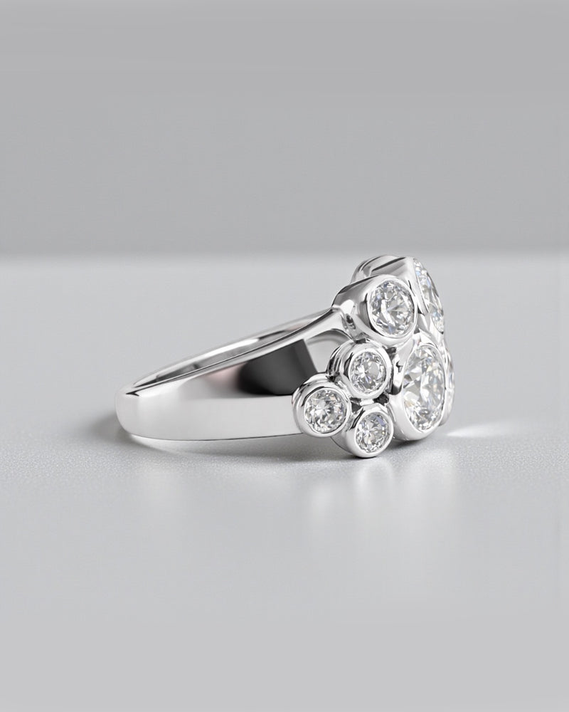 Bubble diamond ring with bezel set round diamonds, front view showing clustered bubble design. 9kt or 18kt yellow or white gold