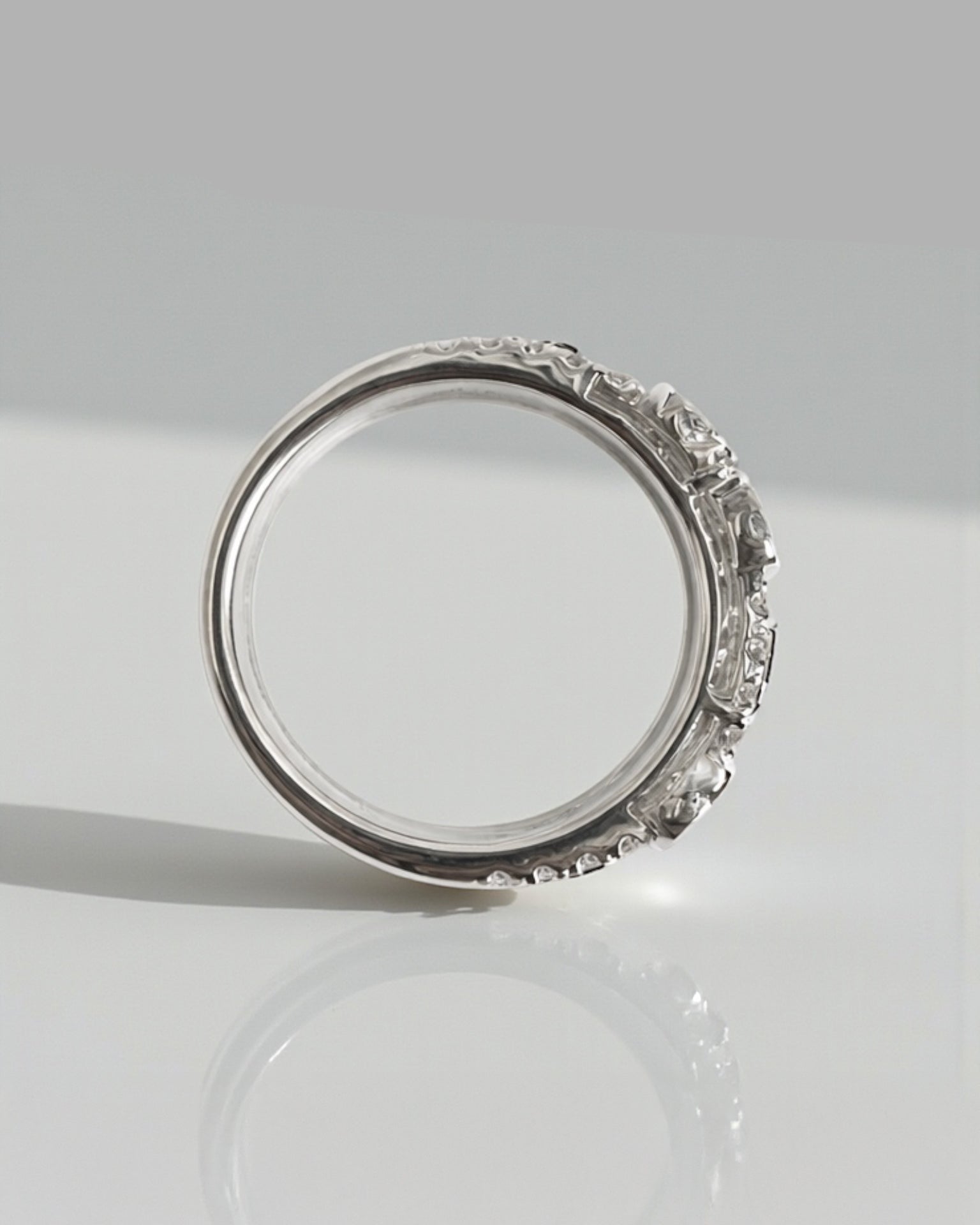 Bezel set bubble diamond dress ring with round diamonds in platinum or 18kt white gold