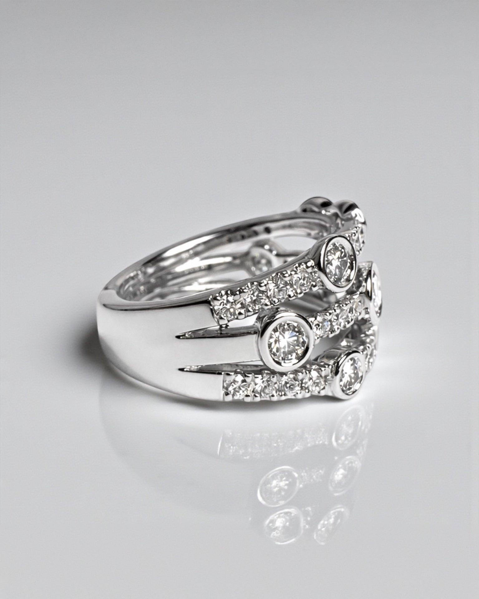 Bezel set bubble diamond dress ring with round diamonds in platinum or 18kt white gold