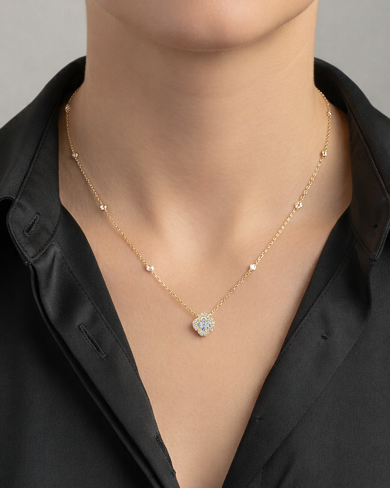 Diamond clover pendant necklace in yellow gold featuring a 0.70ct diamond clover motif on an 18 inch fine chain