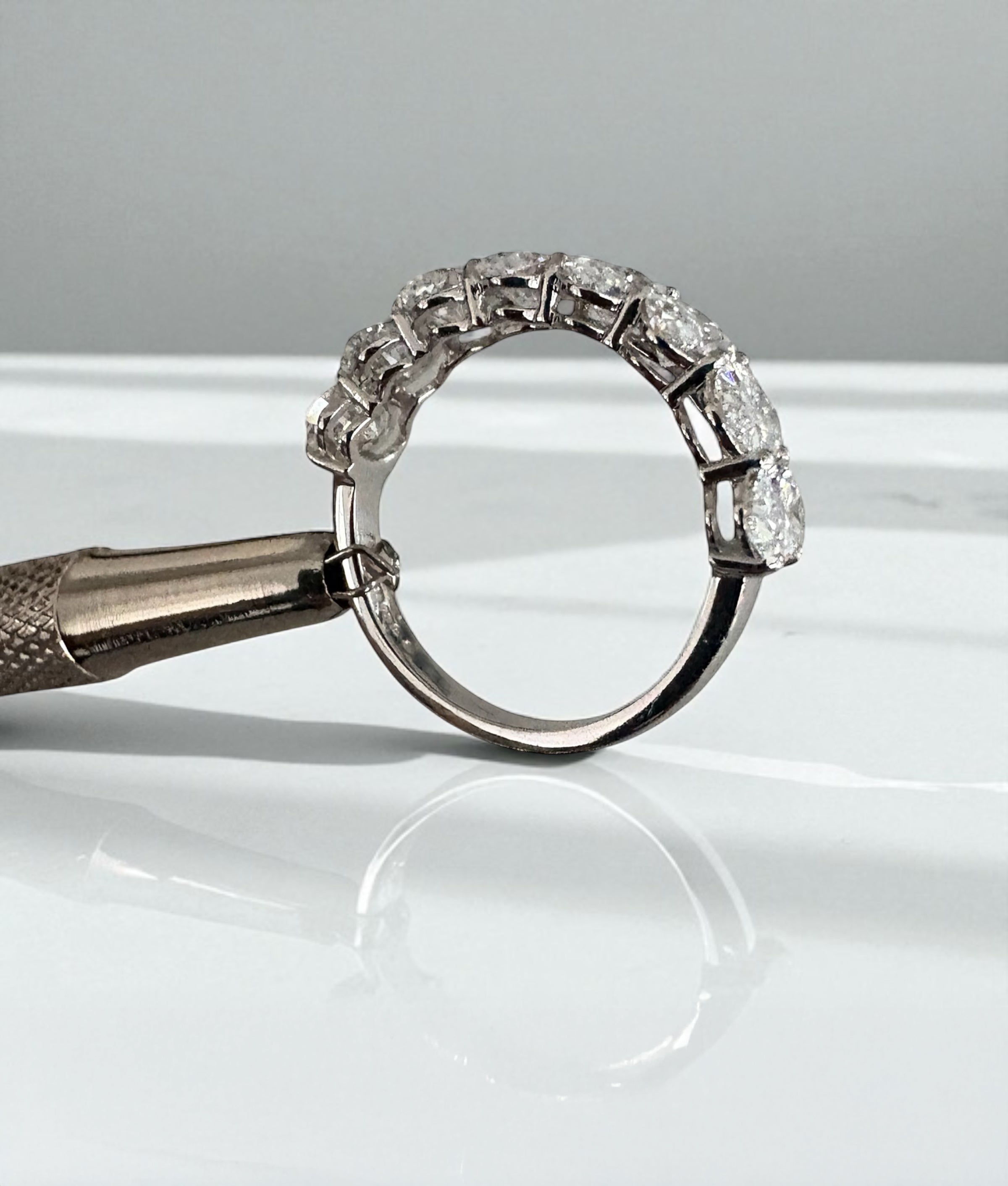 Side profile of a 3ct oval diamond band, part of our diamond engagement rings for women range.