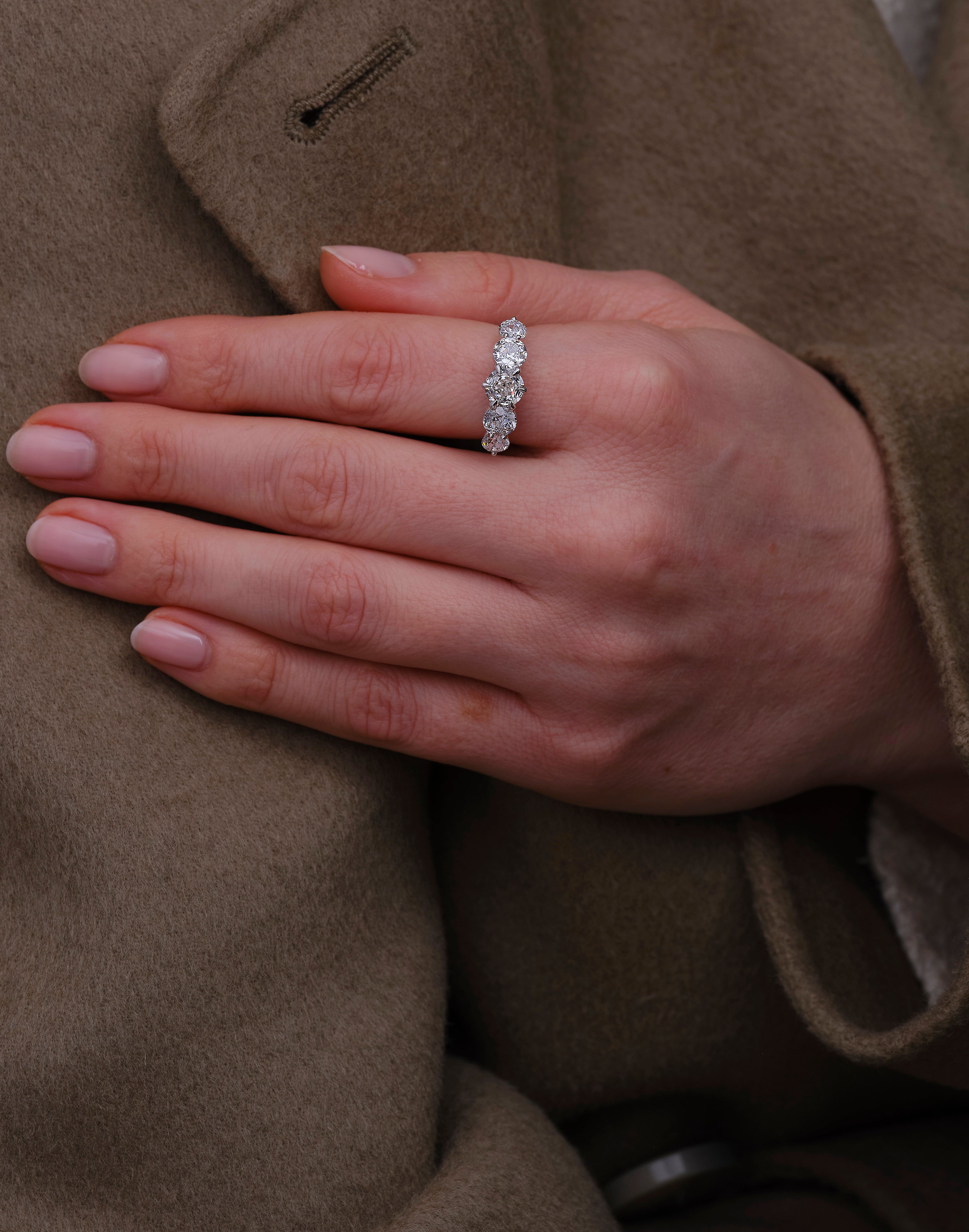 Perspective view of a high-quality 3ct graduated 5-stone band for diamond rings for women sets.