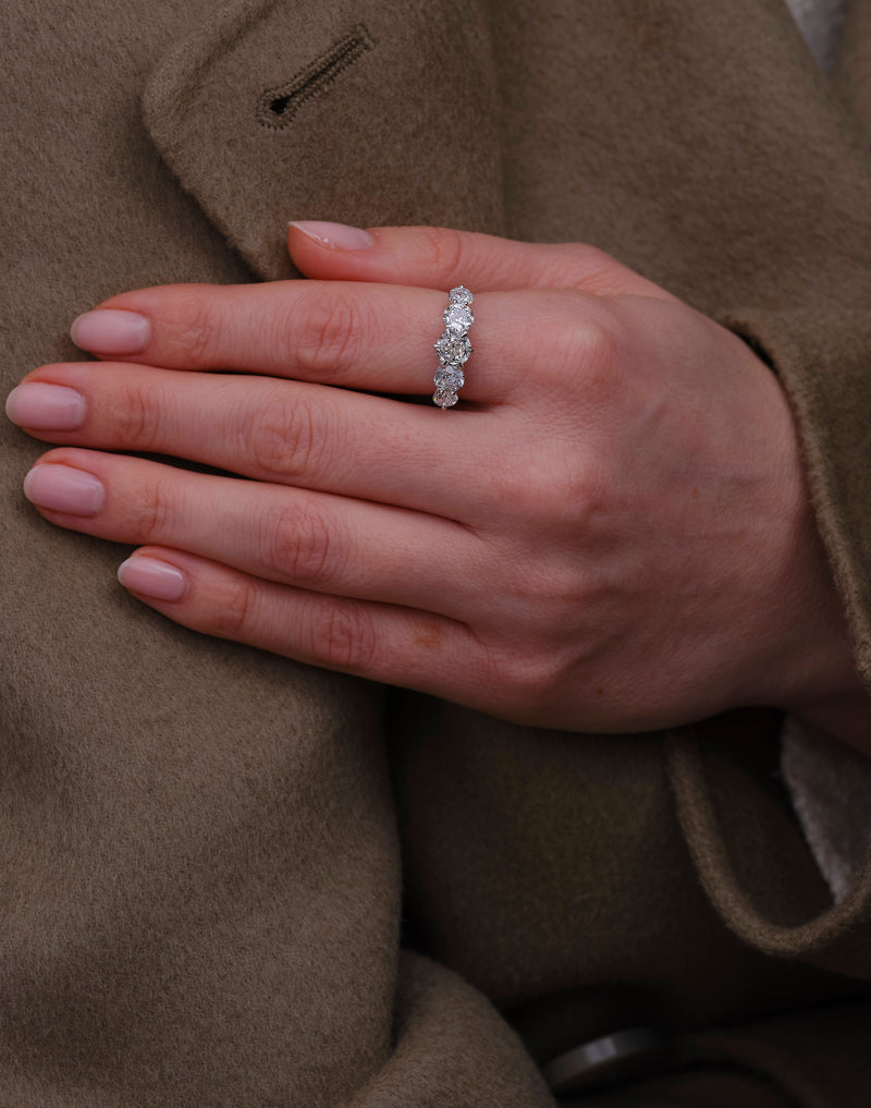 Perspective view of a high-quality 3ct graduated 5-stone band for diamond rings for women sets.