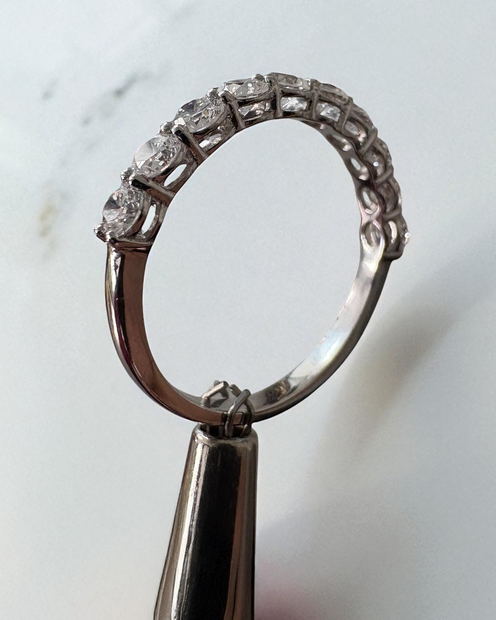 Perspective view of a high-quality 1ct round diamond ring for diamond wedding bands bridal sets.