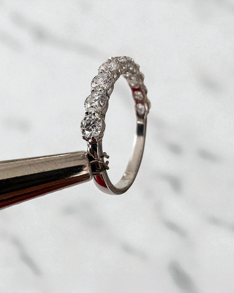 1ct round diamond half eternity band worn on a finger, showcasing a timeless diamond wedding bands design.
