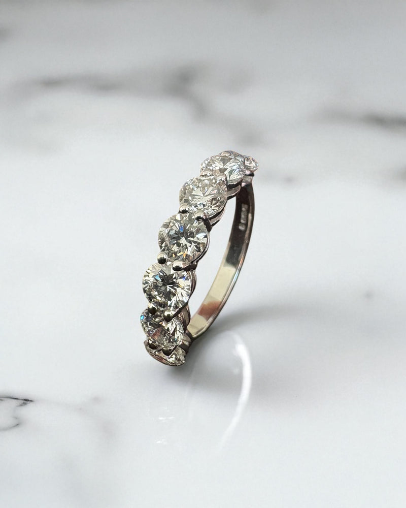 Perspective view of a high-quality 2.50ct round diamond band for diamond wedding bands for women sets.