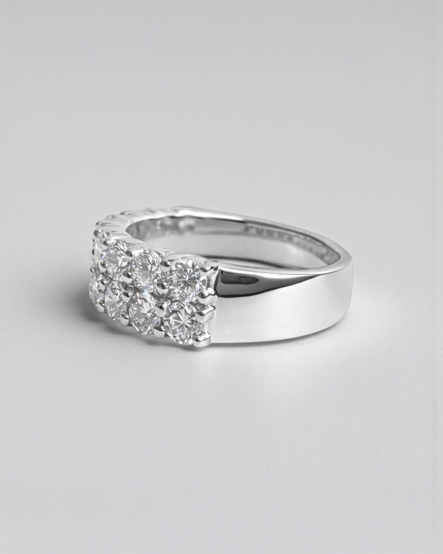 side view of double row diamond eternity ring with round brilliant diamonds arranged in a continuous double row. 9kt or 18kt white or yellow gold or platinum