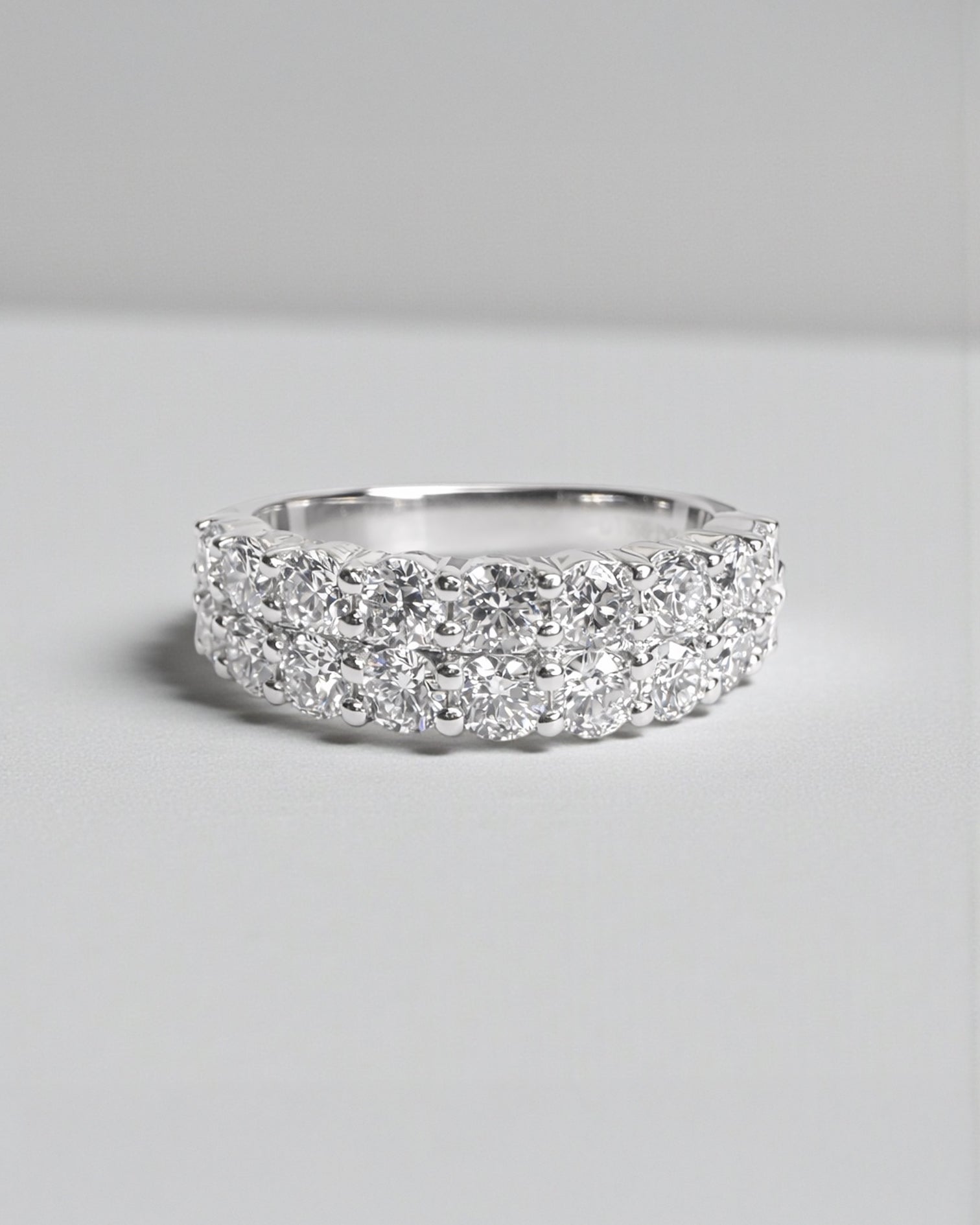 Front view of double row diamond eternity ring with round brilliant diamonds arranged in a continuous double row. 9kt or 18kt white or yellow gold or platinum