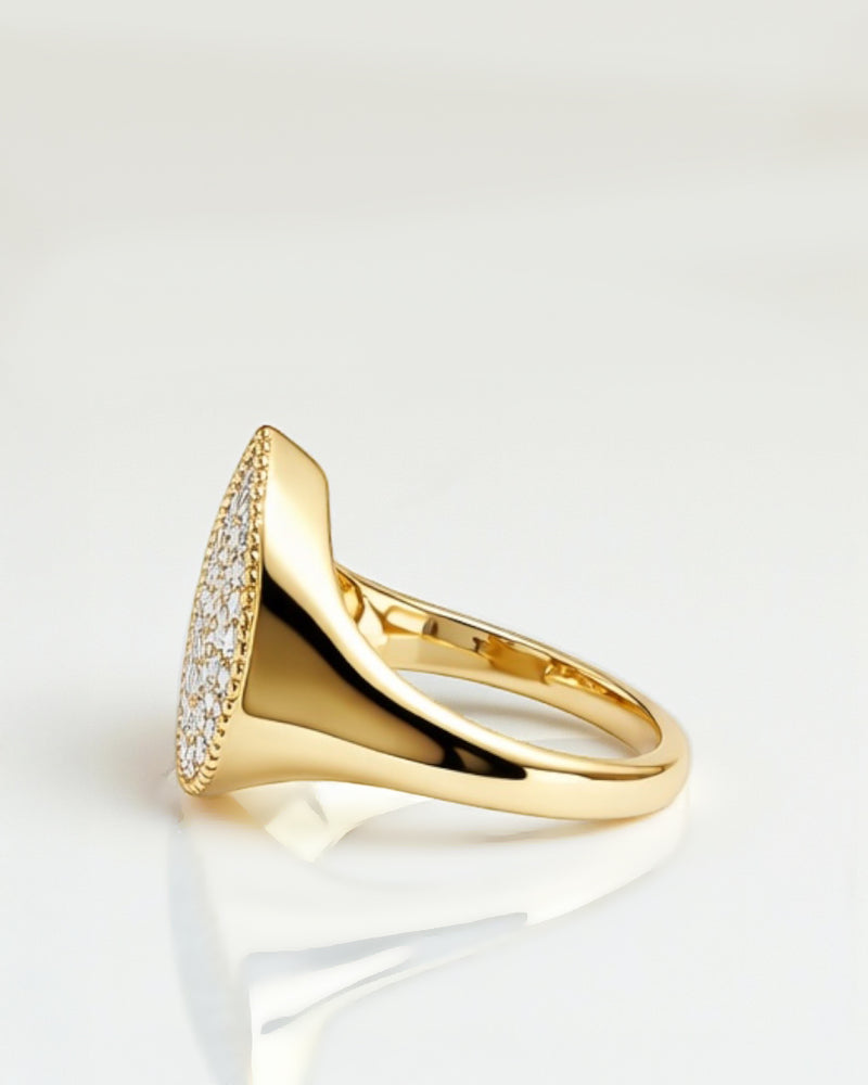 Side profile of pear drop diamond cluster signet ring in 9kt or 18kt yellow gold, showing smooth sculpted shoulders and polished finish.