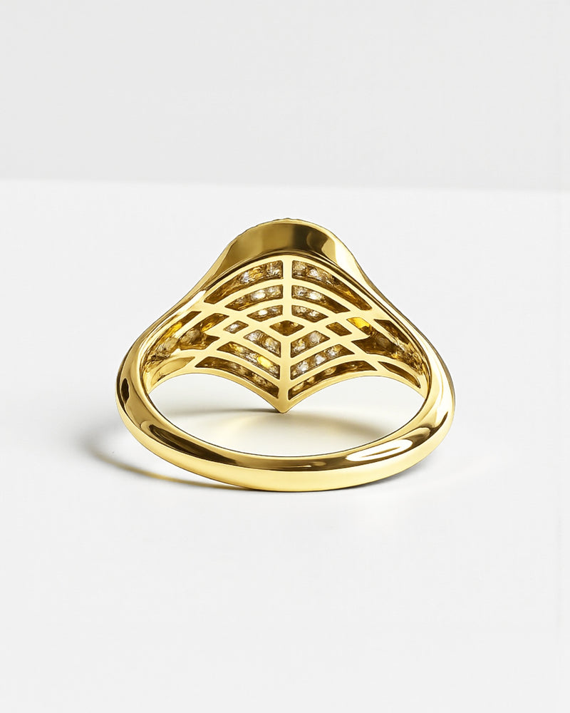 Rear view of pear drop diamond cluster signet ring in yellow gold, showing open lattice gallery and diamond set interior.