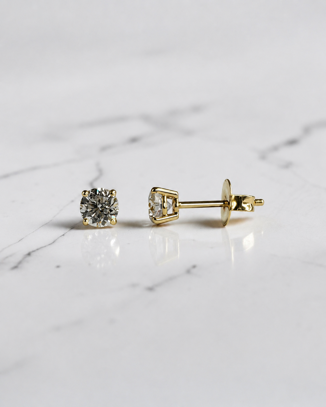 0.70ct round brilliant lab grown diamond stud earrings in a classic four prong setting handcrafted by Layla Diamonds