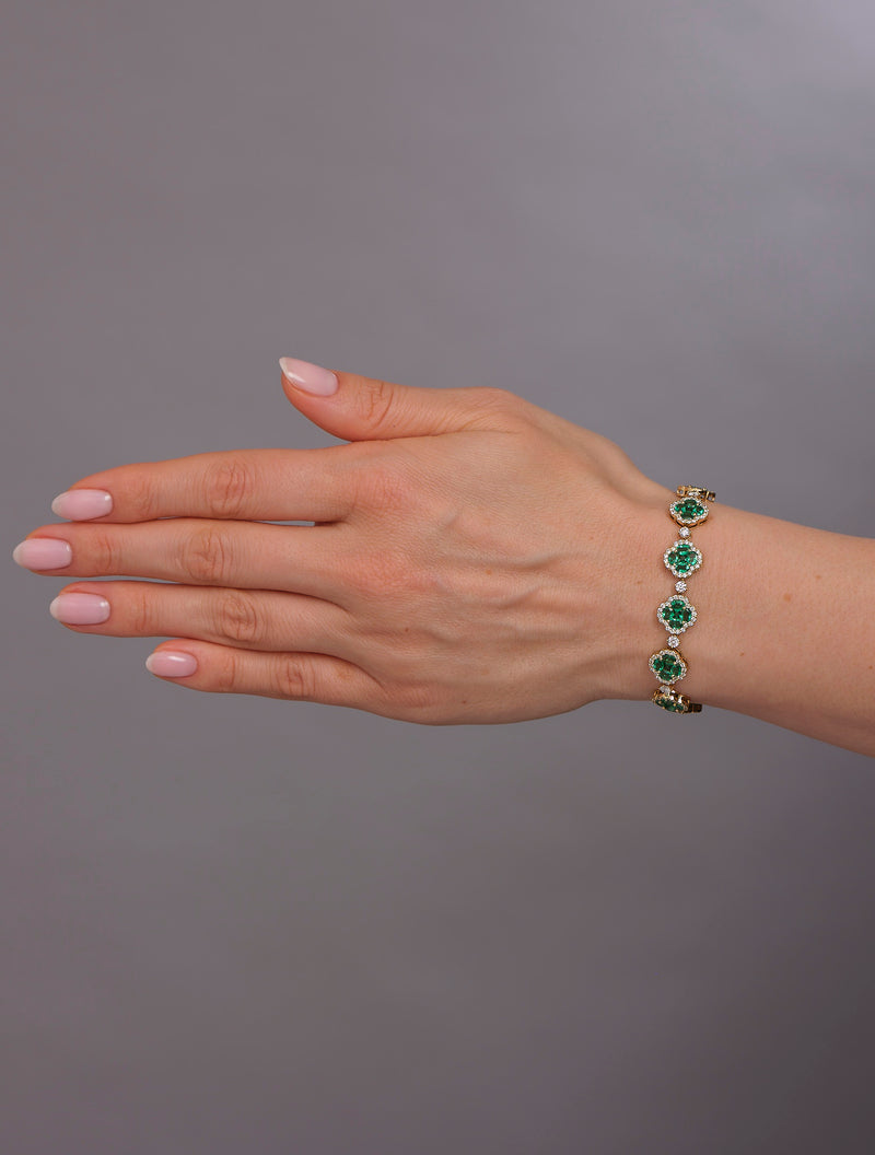Diamond & Emerald Clover Bracelet featuring 3.50ct F VS2+ diamonds and 10ct emeralds, handcrafted in London by Layla Diamonds UK lab grown diamonds mined diamonds natural  on hand, wrist, arm
