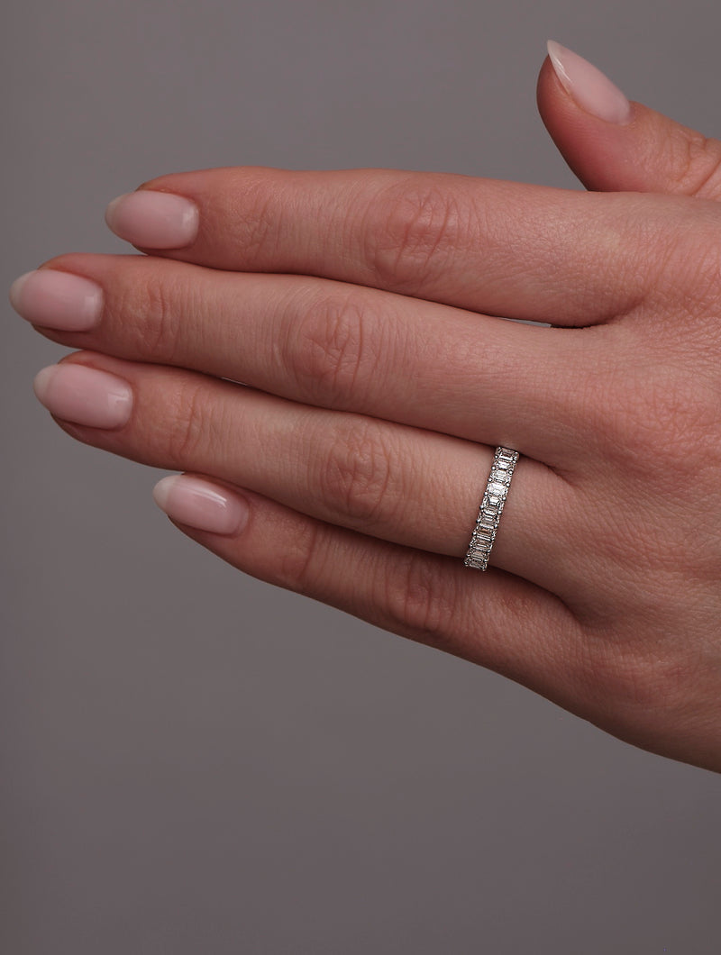 Side profile of the mini emerald cut diamond band, showcasing the clean step-cut profile.