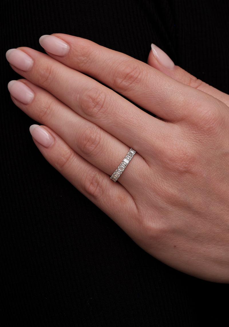 A stunning mini emerald cut diamond eternity ring from our bridal jewelry collection.