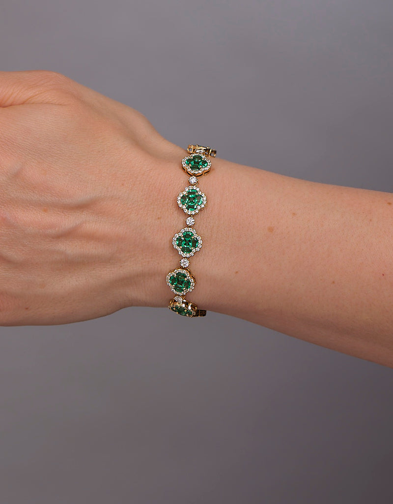 Diamond & Emerald Clover Bracelet featuring 3.50ct F VS2+ diamonds and 10ct emeralds, handcrafted in London by Layla Diamonds UK lab grown diamonds mined diamonds natural  on hand, wrist, arm