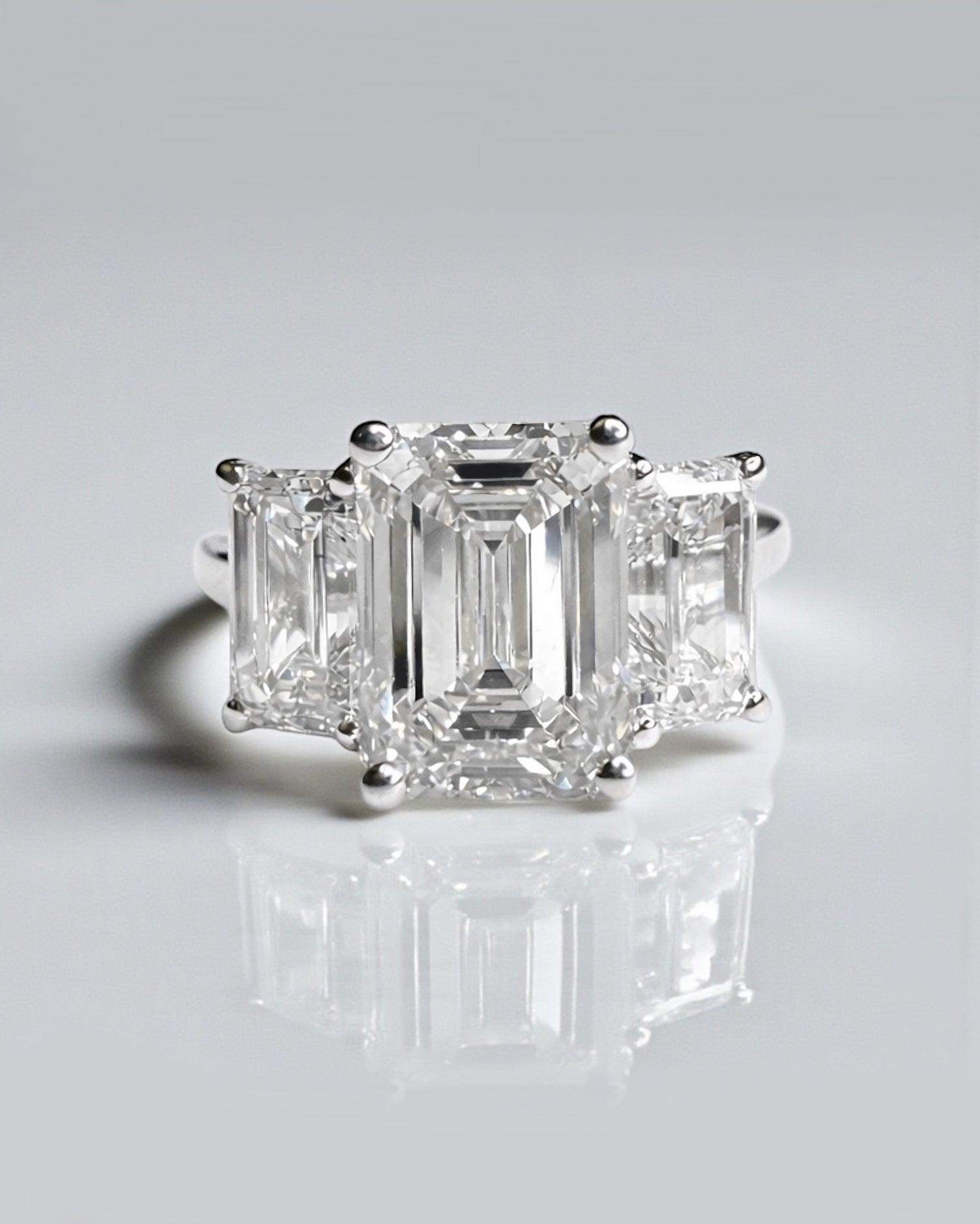 Emerald cut diamond trilogy engagement ring with 3ct centre lab grown diamond, total 5ct diamonds platinum or 18kt white gold 