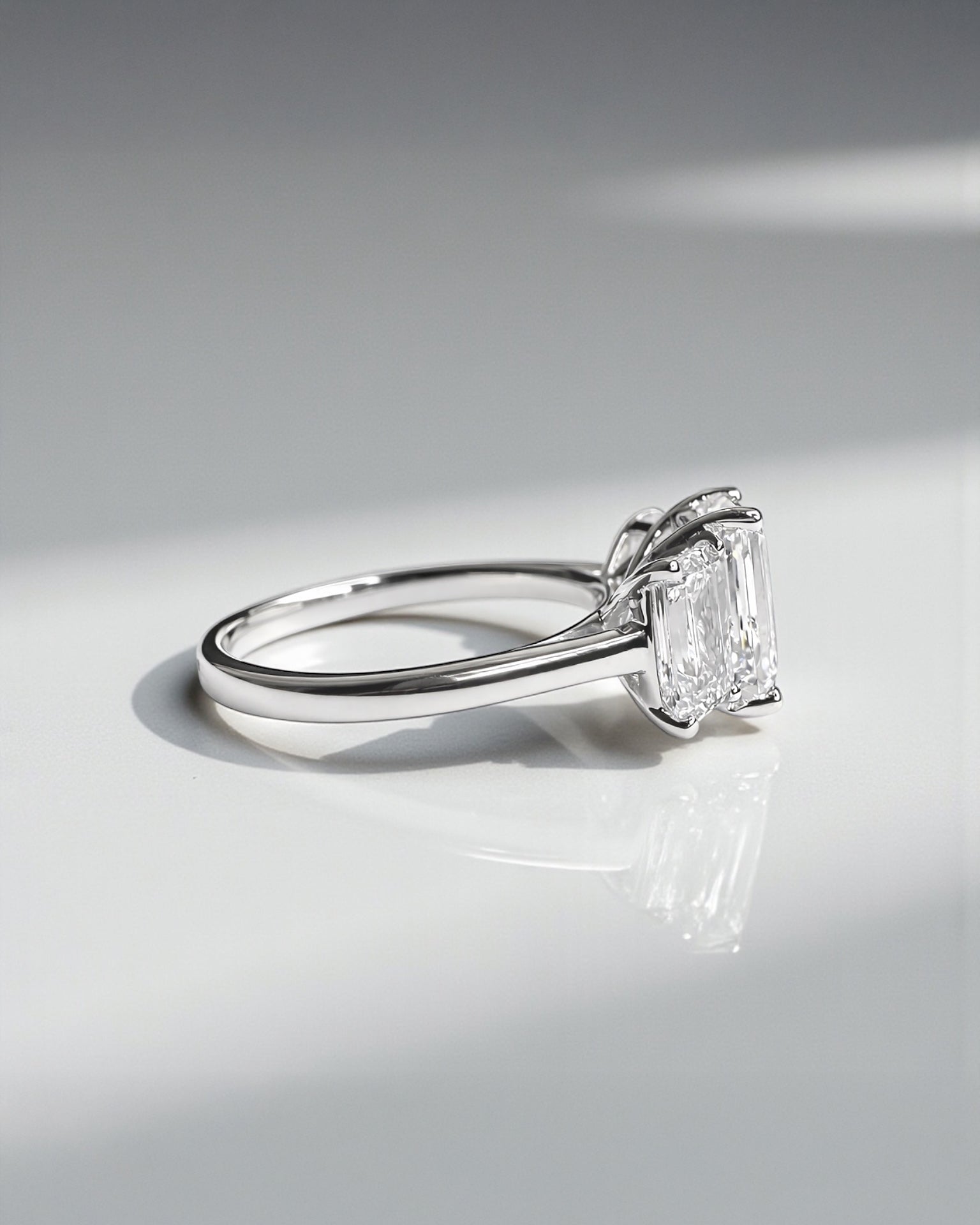 Emerald cut diamond trilogy engagement ring with 3ct centre lab grown diamond, total 5ct diamonds platinum or 18kt white gold 