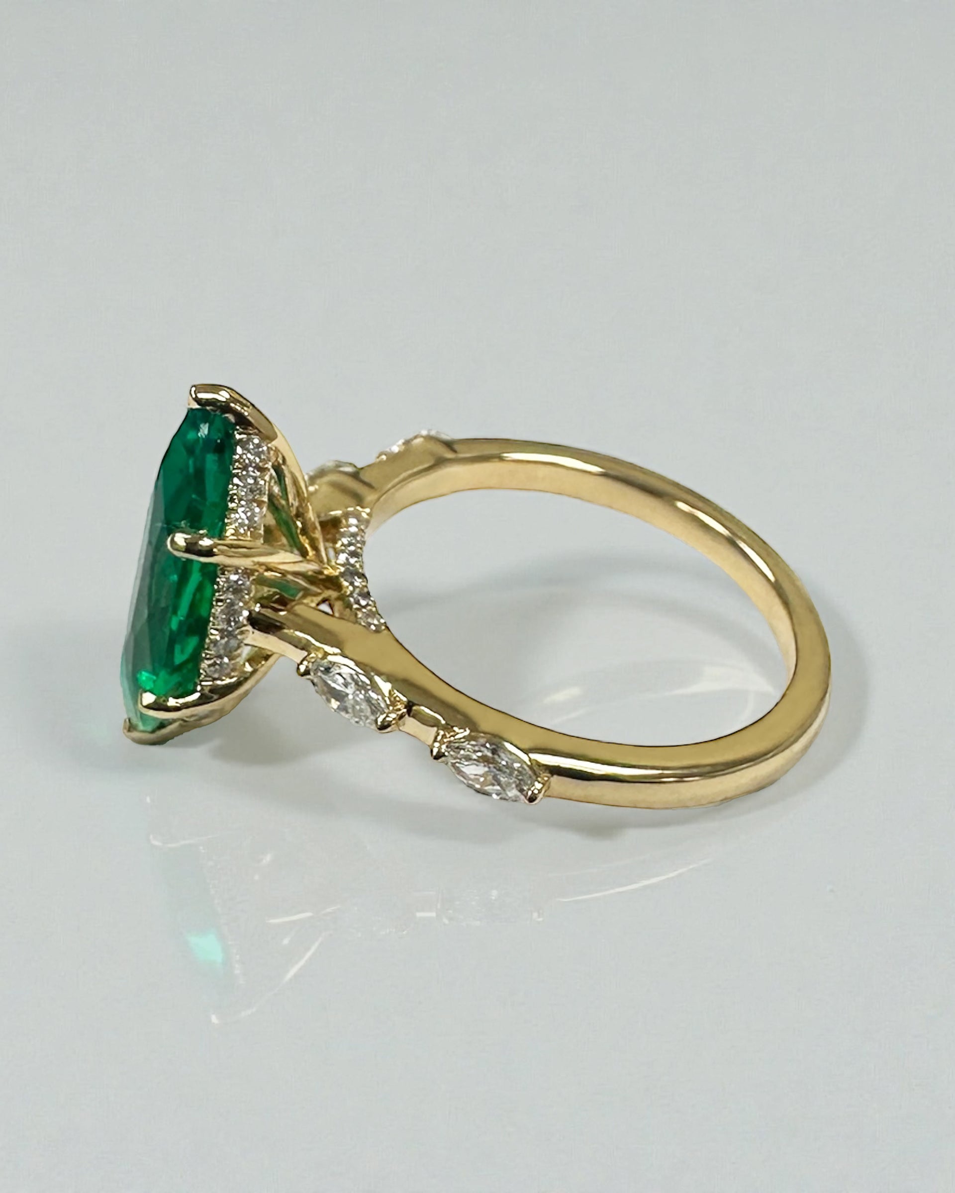 2.40ct marquise cut lab grown emerald engagement ring with marquise diamond shoulders, hidden halo and cathedral setting in 18kt gold or platinum