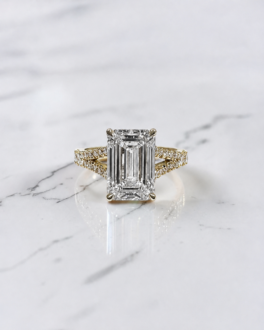 3ct emerald cut lab grown diamond engagement ring with a diamond split shank band, handcrafted in London and available in Platinum, 18ct yellow, white or rose gold.