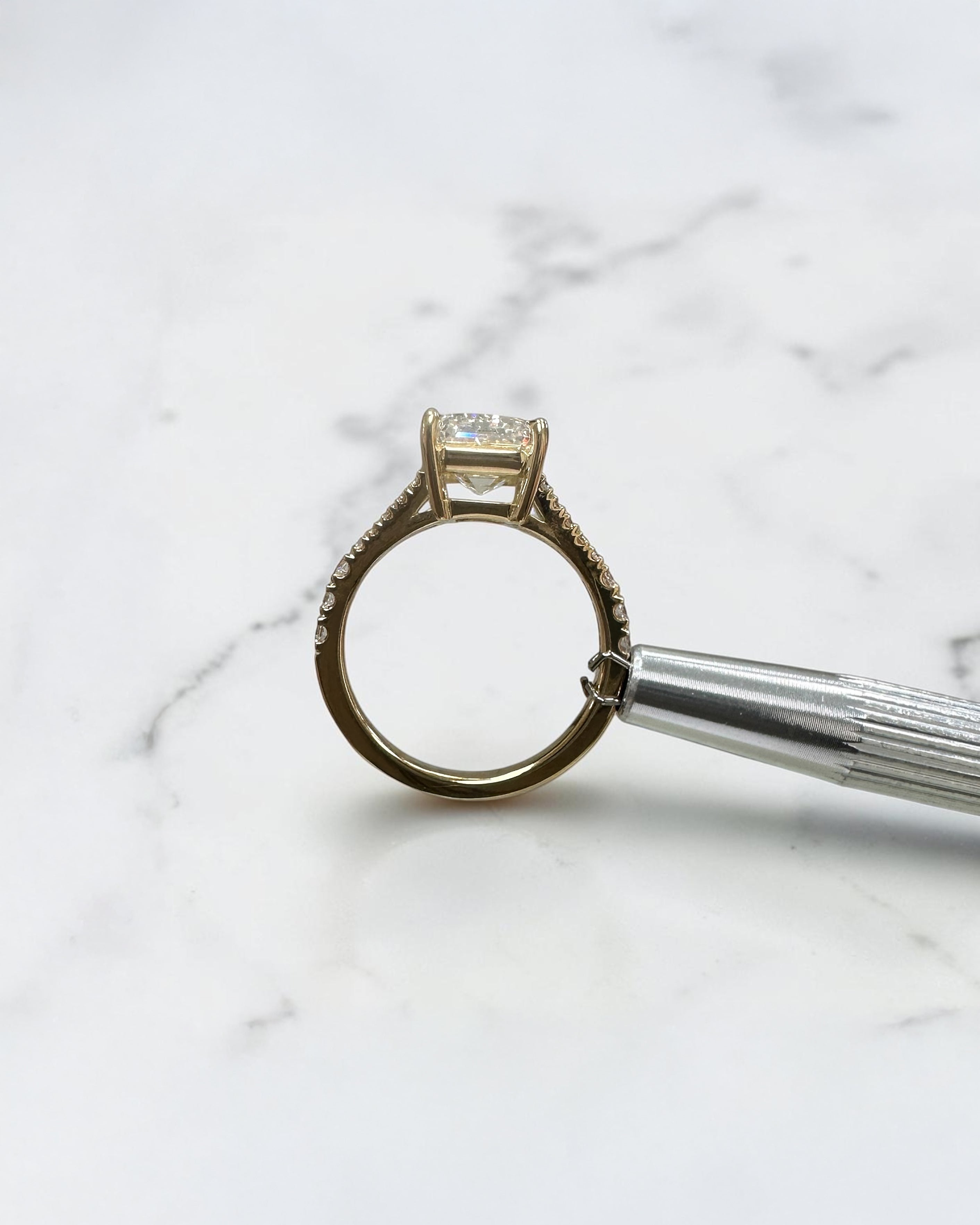 3ct emerald cut lab grown diamond engagement ring with a diamond split shank band, handcrafted in London and available in Platinum, 18ct yellow, white or rose gold.