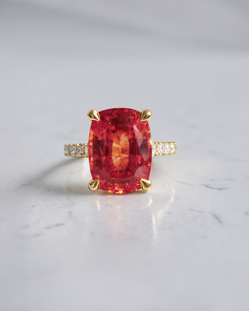 Luxury 5.80ct padparadscha sapphire engagement ring with diamond shoulders handcrafted in London.