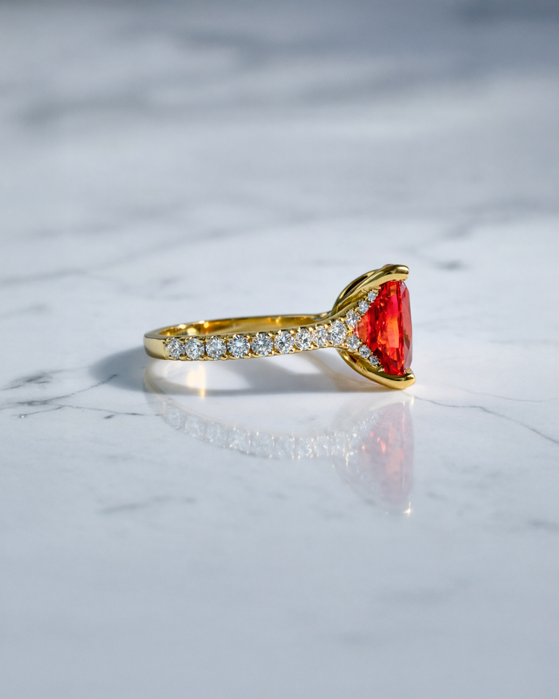 Luxury 5.80ct padparadscha sapphire engagement ring with diamond shoulders handcrafted in London.