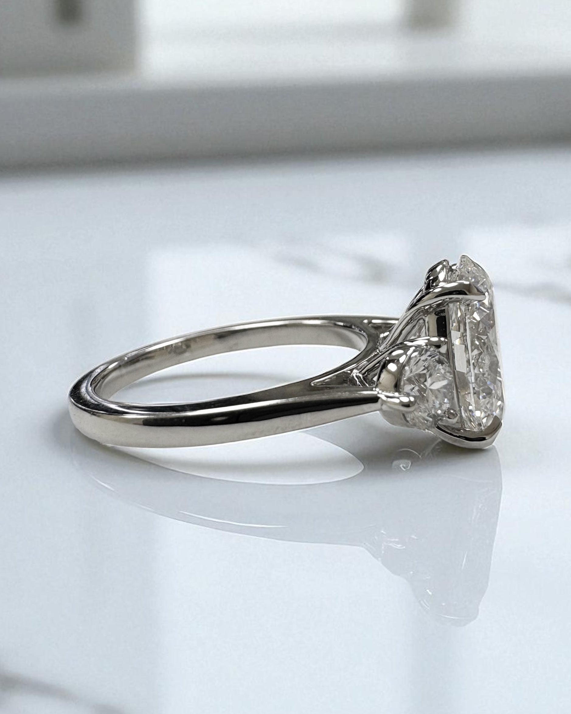 3.50ct lab grown oval cut diamond and round brilliant trilogy engagement ring