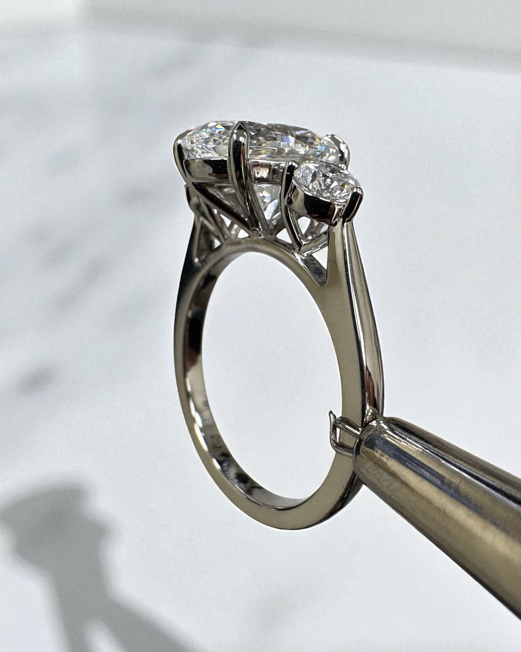 3.50ct lab grown oval cut diamond and round brilliant trilogy engagement ring