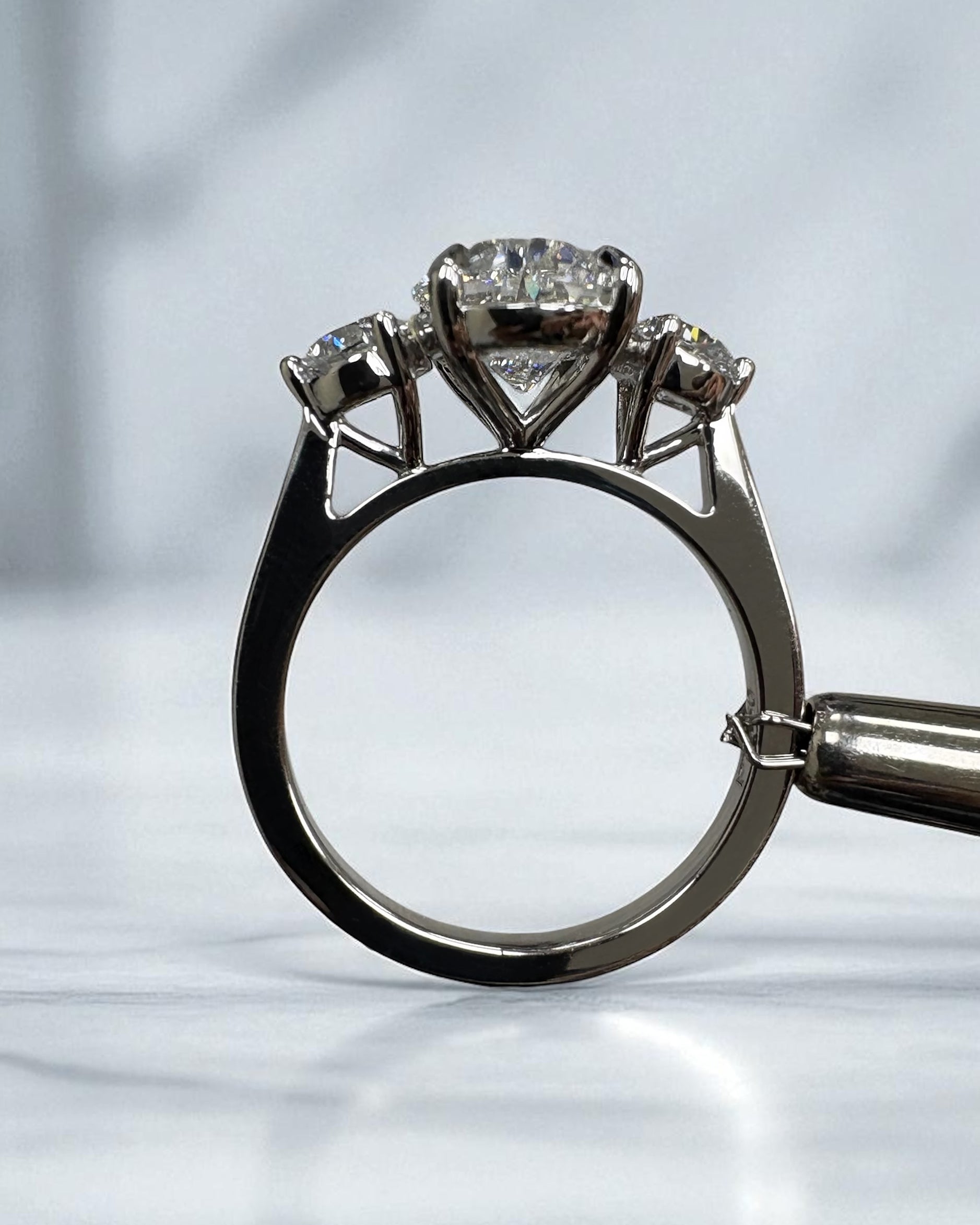 3.50ct lab grown oval cut diamond and round brilliant trilogy engagement ring