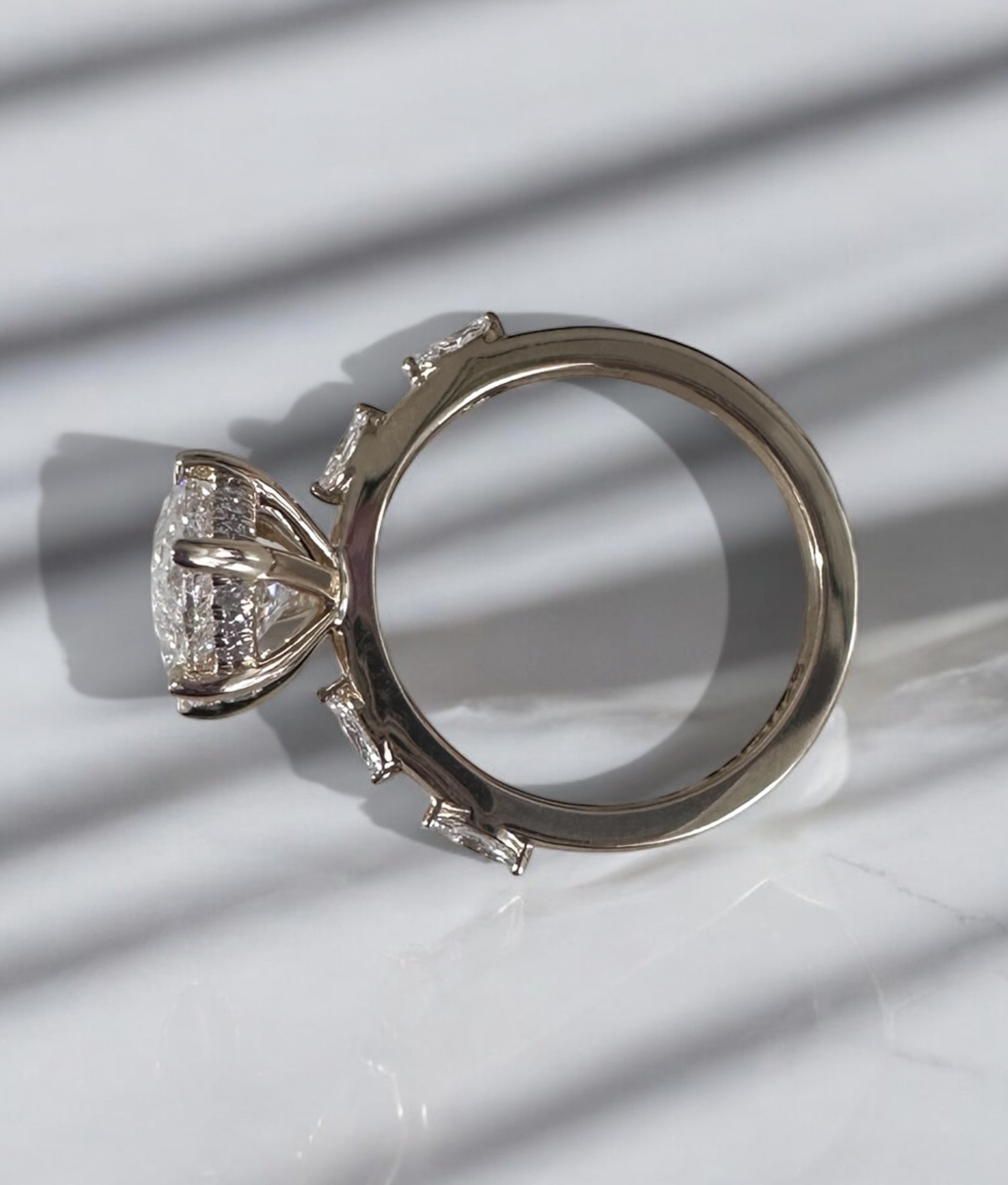 3.50ct lab grown marquise engagement ring with spaced band.