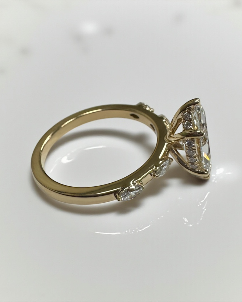 Detailed view of the marquise diamond ring and its unique marquise diamond band.