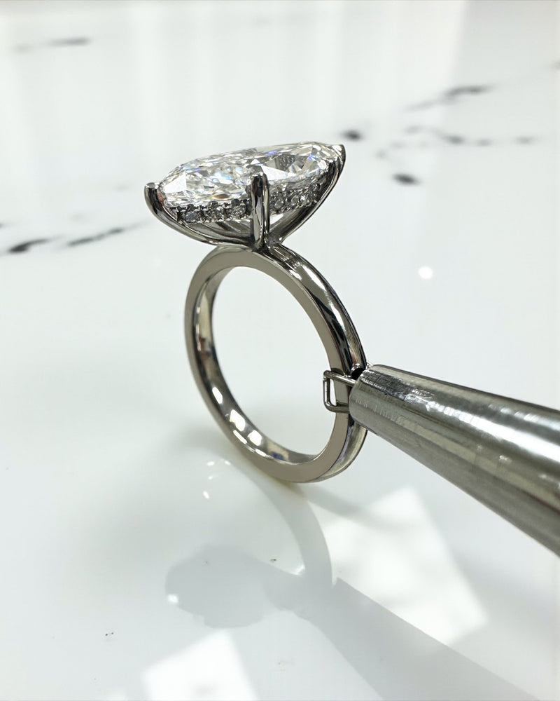 3.50ct marquise diamond ring in a solitaire setting with a floating head.